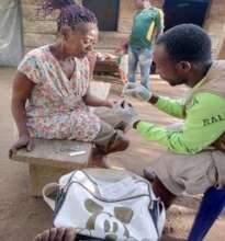 CHW testing an elderly woman in Ndian