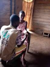 CHW  providing treatment to a beneficiary in Kitta