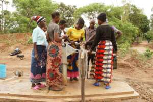 Examining parts of the well.