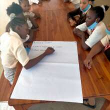Students in groups, answering questions on waste