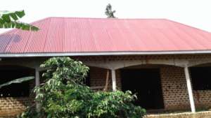 PHOTO SHOWING CONSTRUCTION PROGRESS ROOFING STAGE