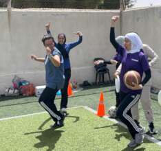 Coaches celebrate their win during a training game