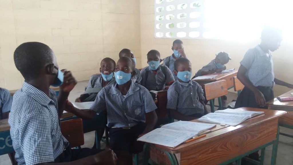 Providing masks to students in Haiti
