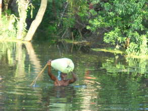 old man struggling during floods
