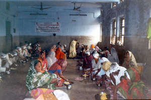 beneficiaries having food after free eye camp