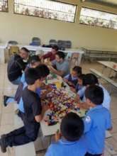 Legos Pieces Being Shared by Many Students