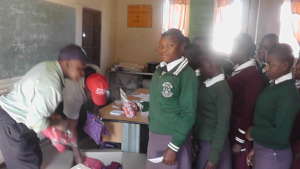 our staff distributing pads
