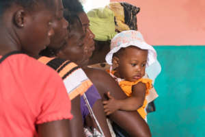 Families stand in line to receive care