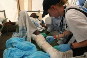 Our staff treats a boy after the 2010 earthquake