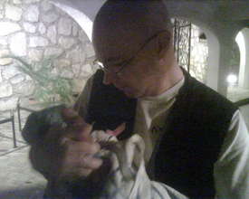 Dr. Liviu Vedrasco holds a tiny patient