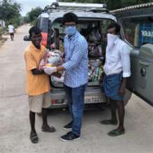 Project leader distributing the relief