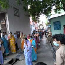 Row of the people to get relief in a slum