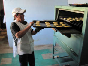 A woman works at her community bank´s business