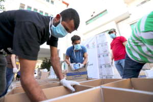 Partners packing the boxes last year