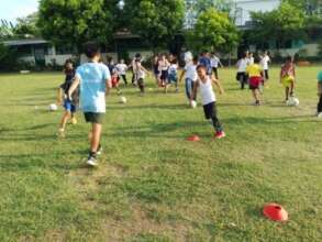 Children enjoy different football drills.