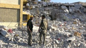 Journalists in front of the destroyed Radio Magic 9