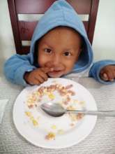 Two year old Alex smiling after his yummy lunch