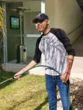 Daniel watering the garden