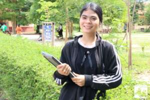 Scholar receiving computer for studies