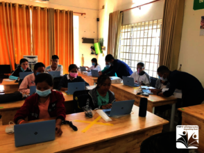 Scholars receiving KOOMPI computer training