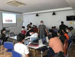 Coding Club leader, Seha, presenting to youth