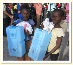 Haitian children carrying WaterBricks