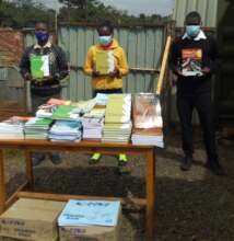 Students with new books bought with your support