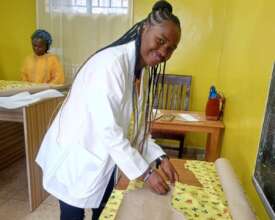 Student taking her practical fashion design exam