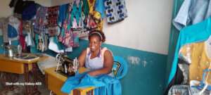 A young mother in her fashion shop