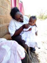 Judy and her baby, supported by our emergency fund