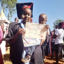 Young mother Phylis receiving her certificate