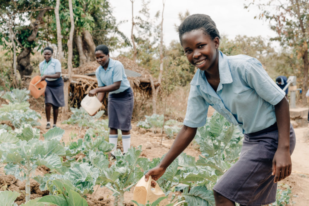 Student waters the crops at Kitui Seed of Hope