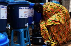 Community chief demonstrates handwashing