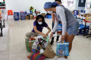 CIAM team members pack up food and sanitation kits