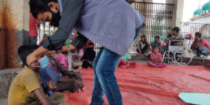 A LEEDO outreach worker distributing supplies