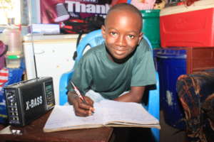 Boy listening to radio educational broadcast