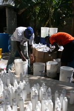 DSI staff prepare bottled chlorine