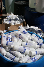 Bottles of just-bottled locally produced chlorine