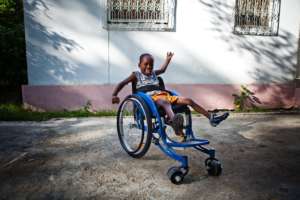 Child in adapted wheelchair