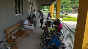 Haitian and Swiss working together on wheelchairs