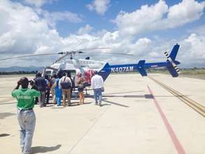 Staff seeing the new helicopter for Haiti