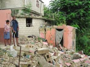 Jean at his distroyed home