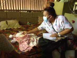 Midwife at home visit for new baby