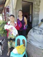New mothers with food gift brought to their door