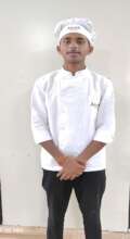 Mohan in his chef dress during training