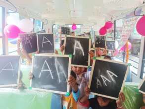 Children writing their first letter