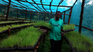 Martin displaying the ready to grow seedlings