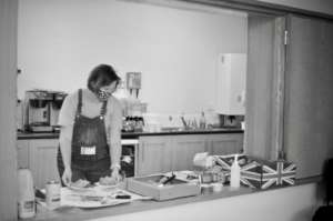 The General Manager serving cake in a break!