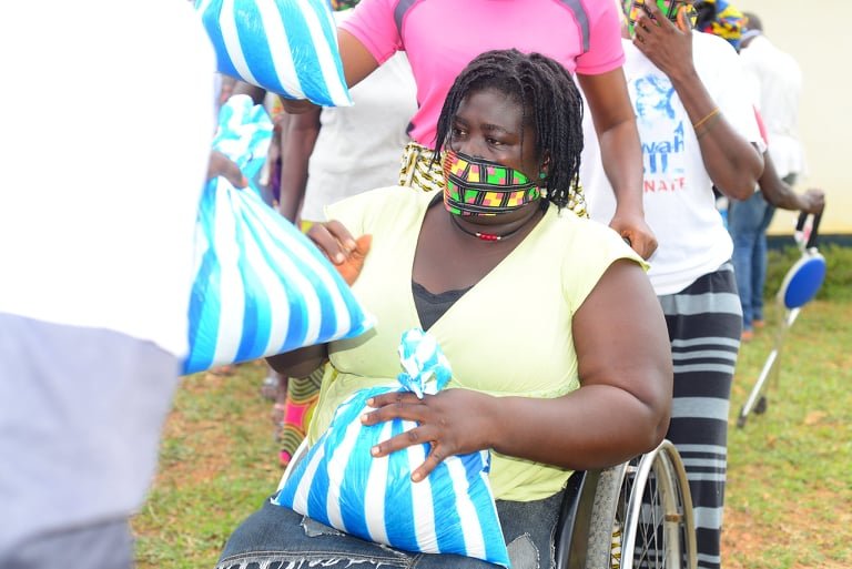 Giving food to the physically challenged