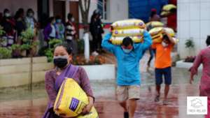 Distributing relief food for trekking porters